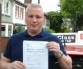 Joe with Driving test pass certificate